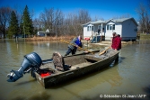 Floods in progress at Rigaud in the suburbs of Montreal, Quebec, Canada on Monday, April 22, 2019. Rigaud citizens with a rowboat in the middle of the road PHOTO: SEBASTIEN ST-JEAN